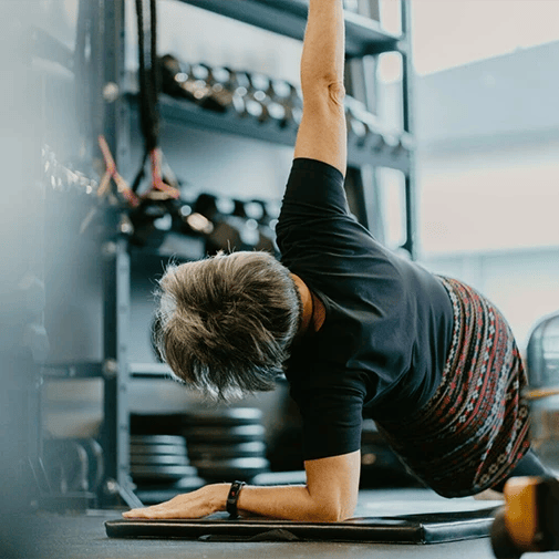 old woman stretching